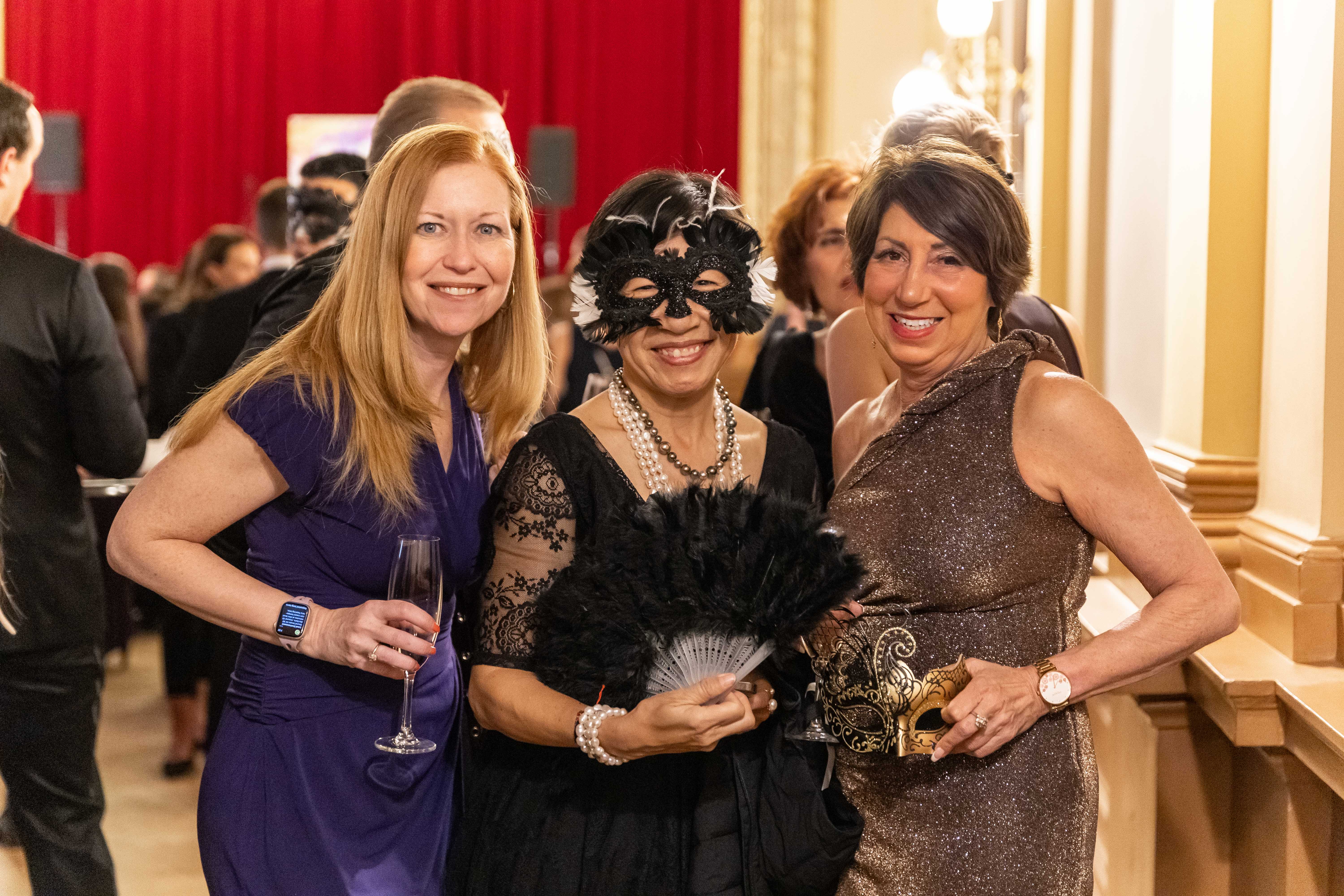 three ladies in masks