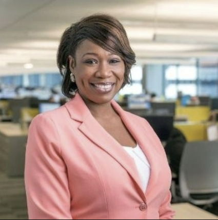 lady in pink jacket smiling