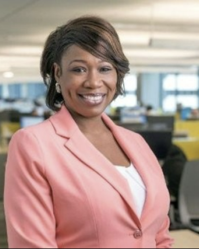 lady in pink jacket smiling
